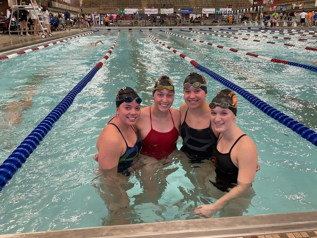 group of four female swimmers